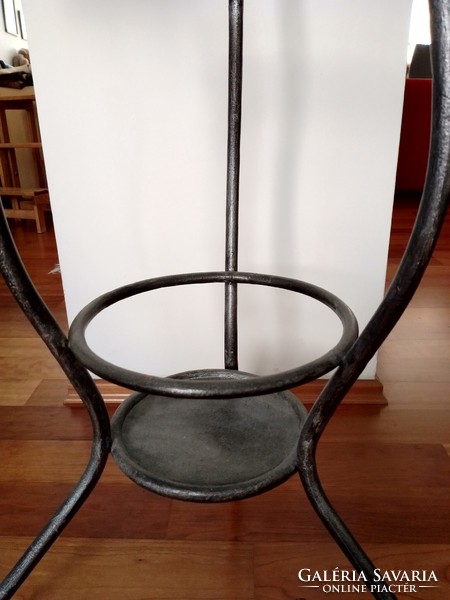 Antique old three-legged round art nouveau iron wash stand with vintage wash basin holder with antique painting