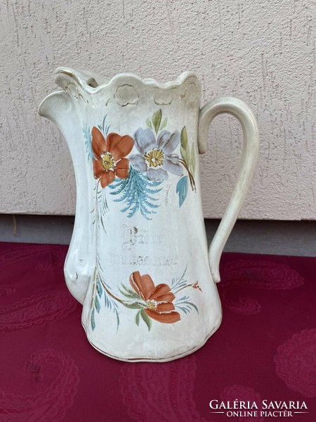 Antique earthenware large jug with floral design