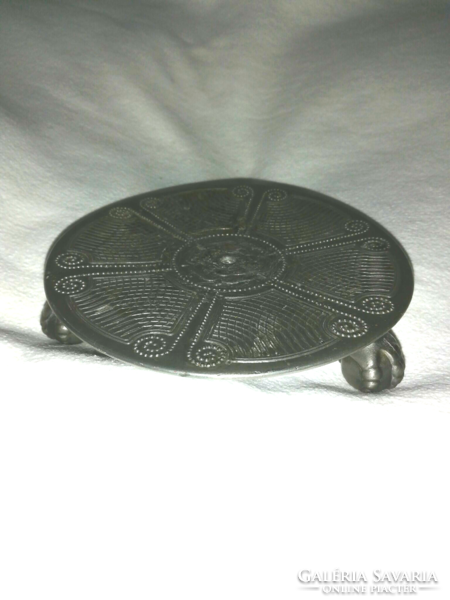 A particularly beautiful, old, decorative metal alloy coaster