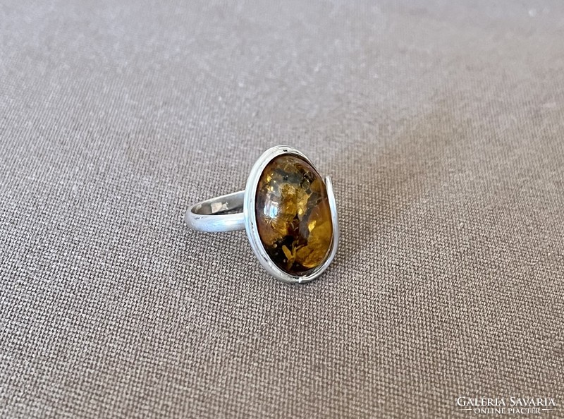 Silver, oval amber ring