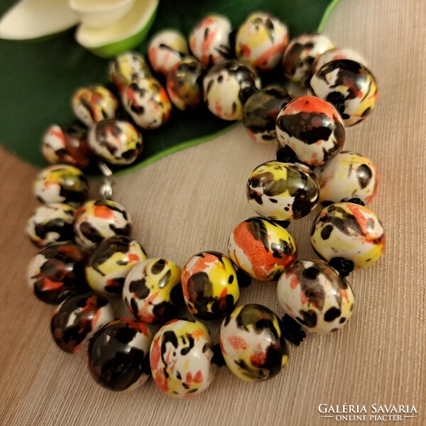 Porcelain handmade string of beads.