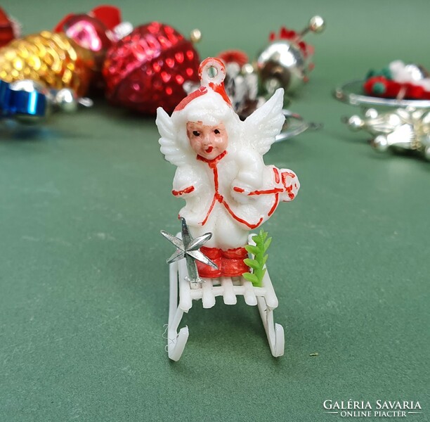 Old retro miniature plastic Christmas tree decoration angel on sleigh with pine tree and star