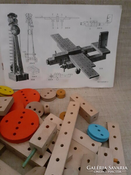 Old retro wooden matador building toy with ingredients booklet