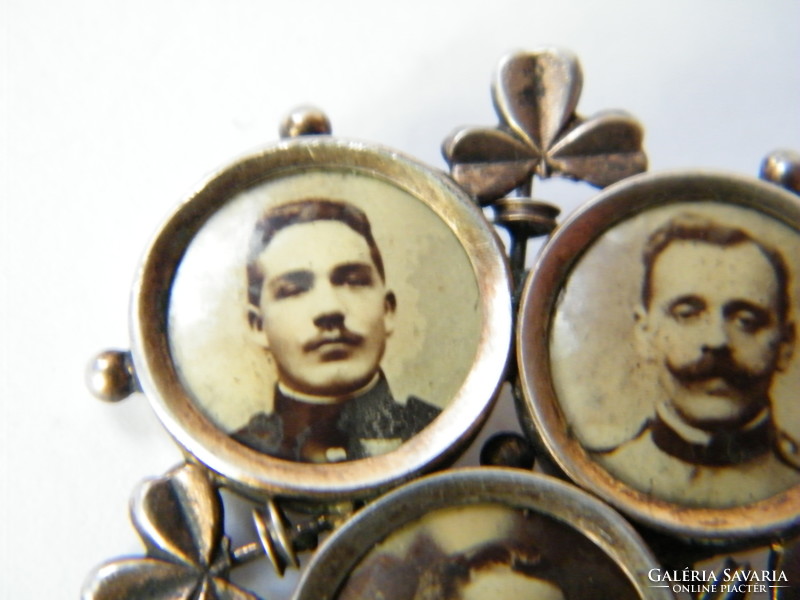 Antique mini metal souvenir holding three portraits