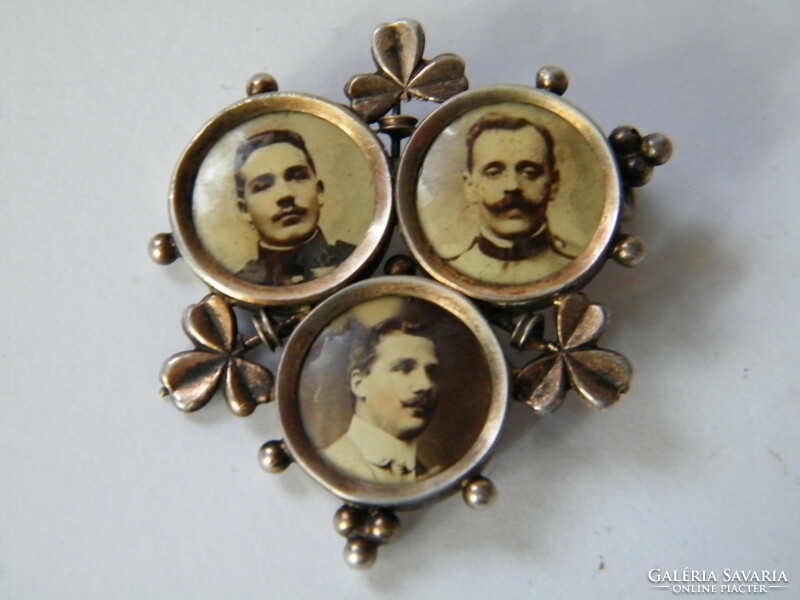Antique mini metal souvenir holding three portraits