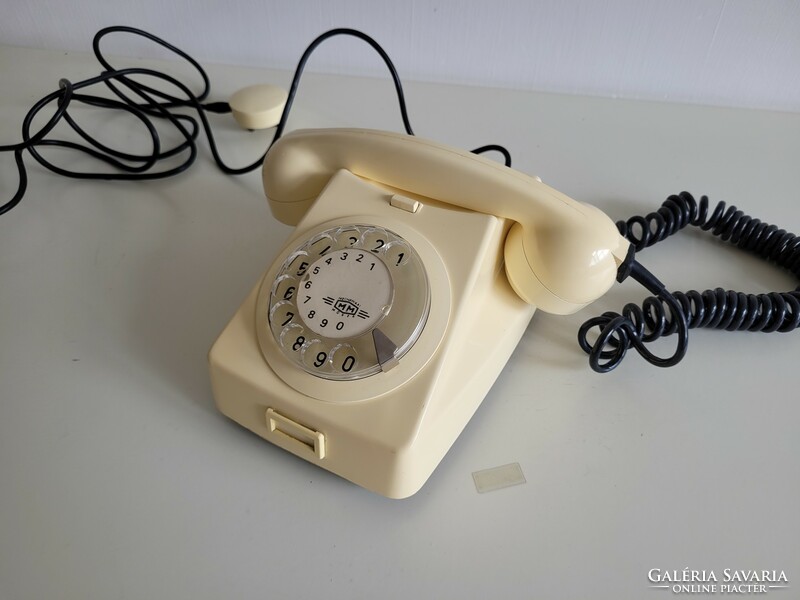 Old retro butter colored mm dial telephone