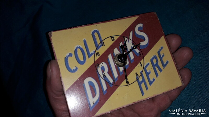An old cola drink mini metal sign turned into a table clock works! 12 X 9 cm according to the pictures