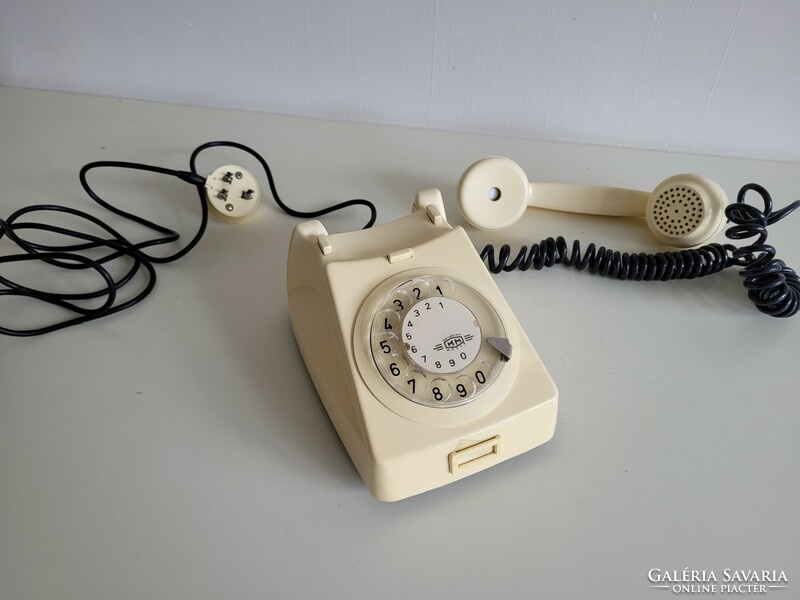 Old retro butter colored mm dial telephone