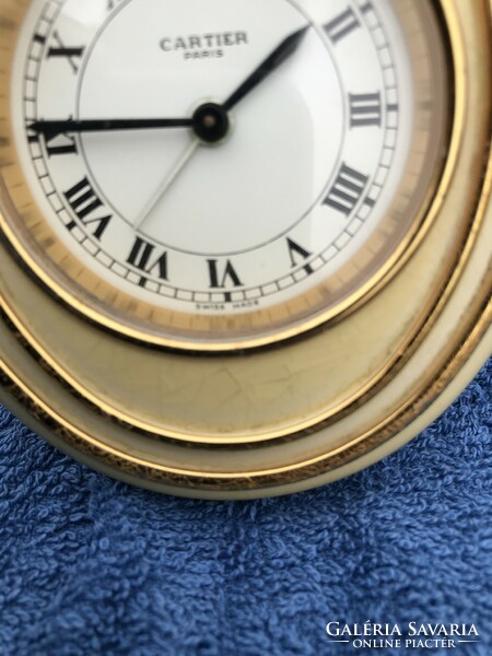 Cartier watch, alarm clock.