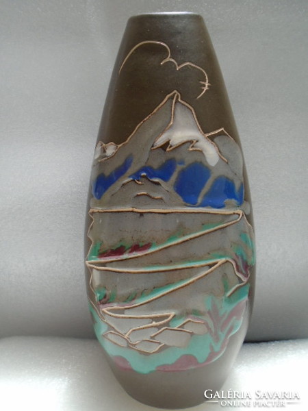 A truly designed ceramic vase depicting very beautiful mountains, a rarity in the display case