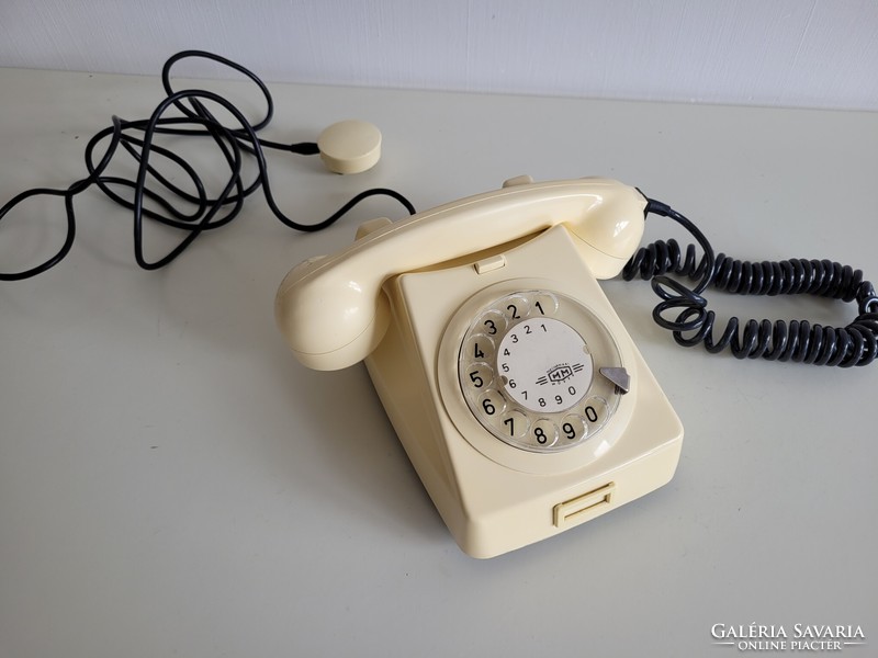 Old retro butter colored mm dial telephone