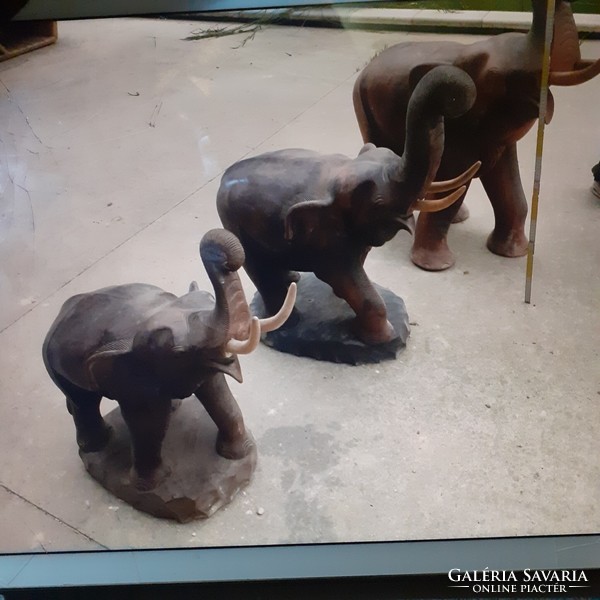 3 giant elephants made of tropical wood.