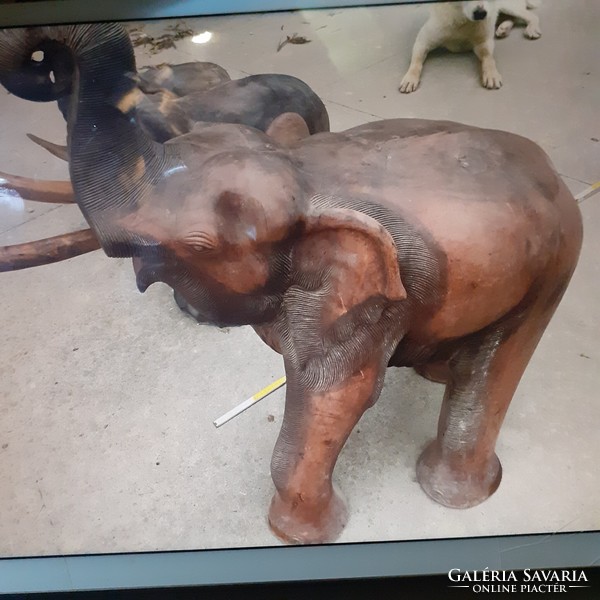 3 giant elephants made of tropical wood.