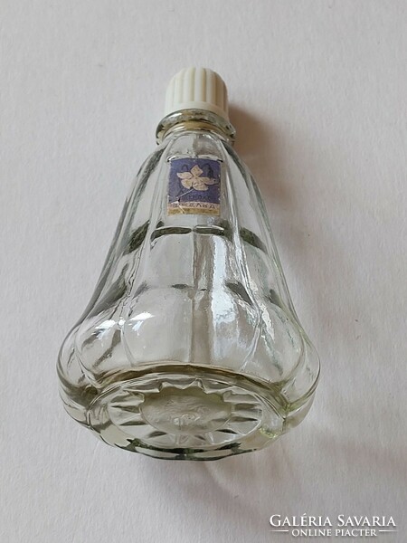 Old perfume glass cologne bottle with retro label