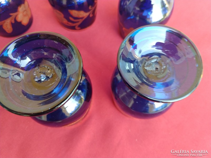 A set of six blue, richly gilded, stemmed glasses with a broken bottom, 12 cm high,,