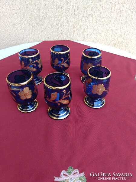 A set of six blue, richly gilded, stemmed glasses with a broken bottom, 12 cm high,,