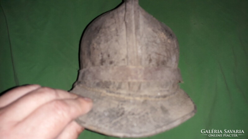 Miner's protective helmet cap made of leather as an antique museum object, according to the pictures