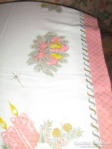 A charming pink tablecloth with a Christmas pattern
