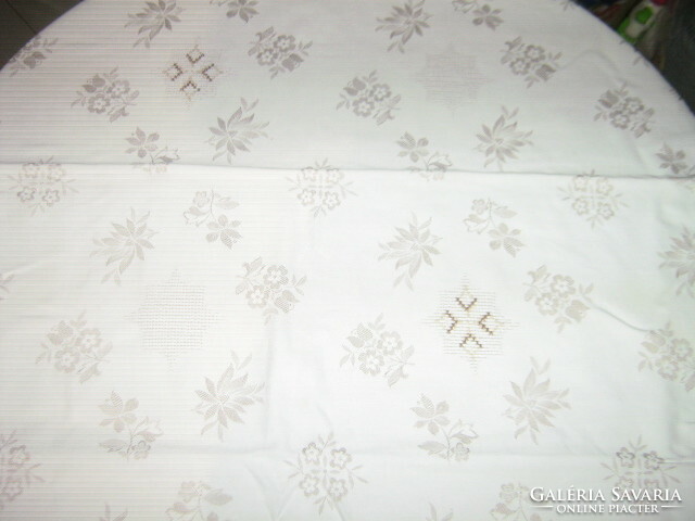 Beautiful damask tablecloth with embroidered flower pattern