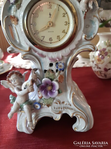 Antique fine porcelain table clock, beautiful, flawless, mechanical, working with Arabic numerals.