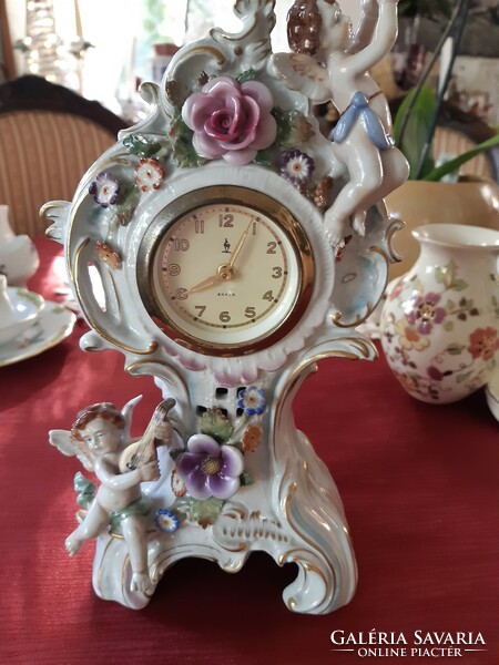 Antique fine porcelain table clock, beautiful, flawless, mechanical, working with Arabic numerals.