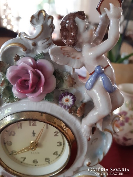 Antique fine porcelain table clock, beautiful, flawless, mechanical, working with Arabic numerals.