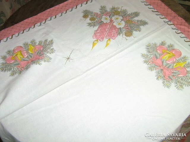 A charming pink tablecloth with a Christmas pattern