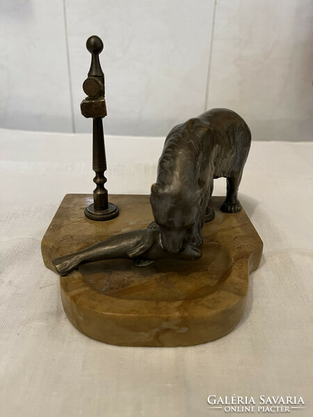 Bronze statue of a bear catching fish, on a marble plinth