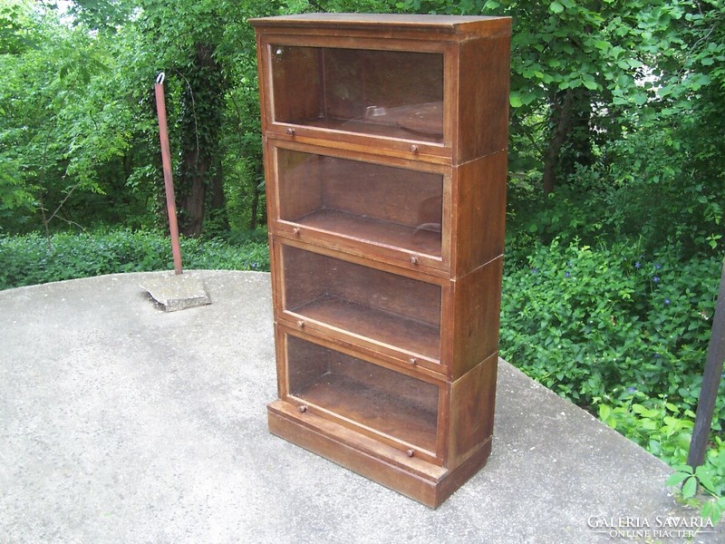 A small glass lingel type bookcase