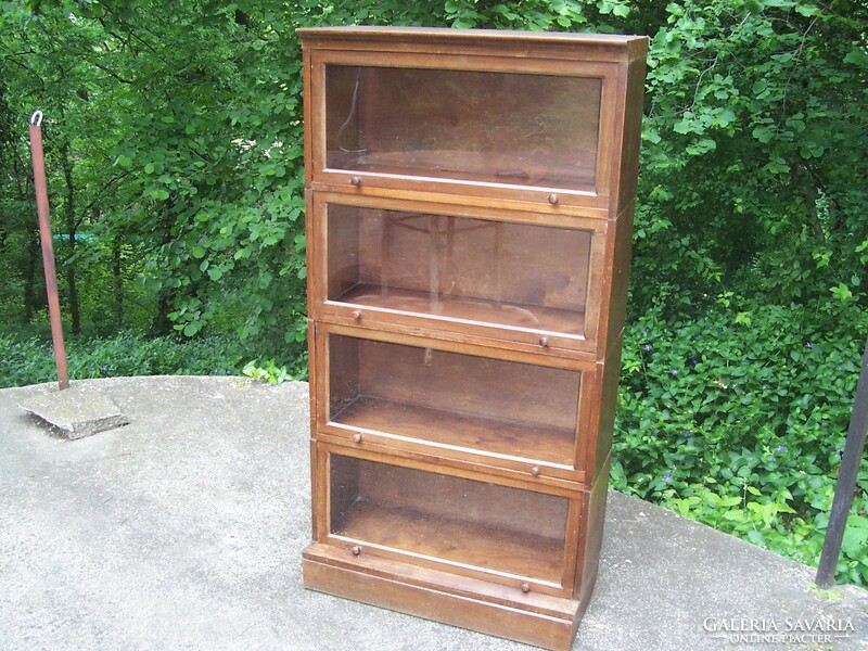 A small glass lingel type bookcase