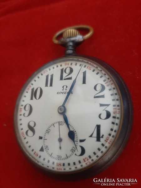 Omega pocket watch in gun steel case