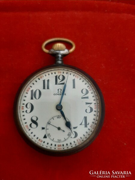 Omega pocket watch in gun steel case