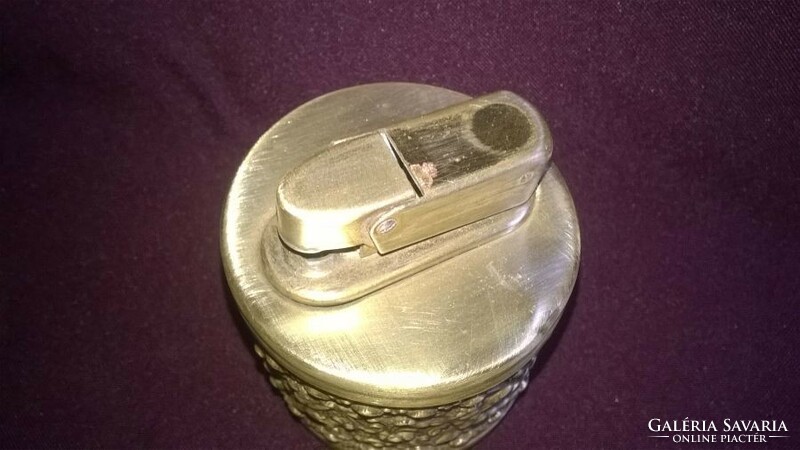 Older table lighter with a copper housing