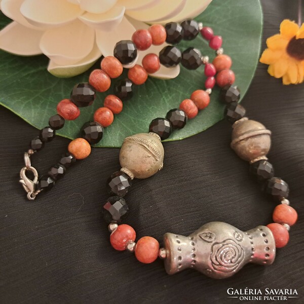 Antique handmade ornaments, coral and crystal necklaces.