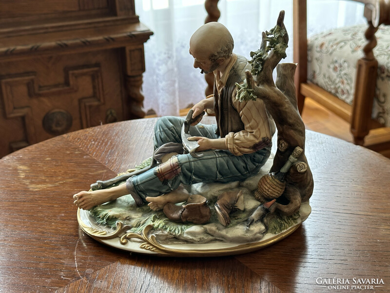 Capodimonte porcelain faience figurine / scythe sharpener