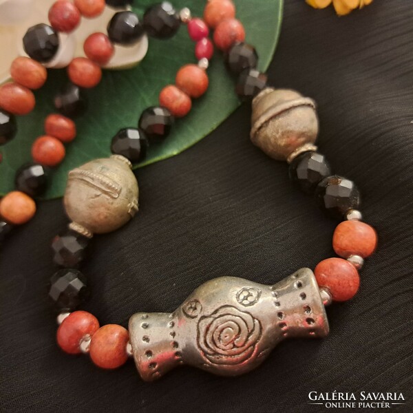 Antique handmade ornaments, coral and crystal necklaces.