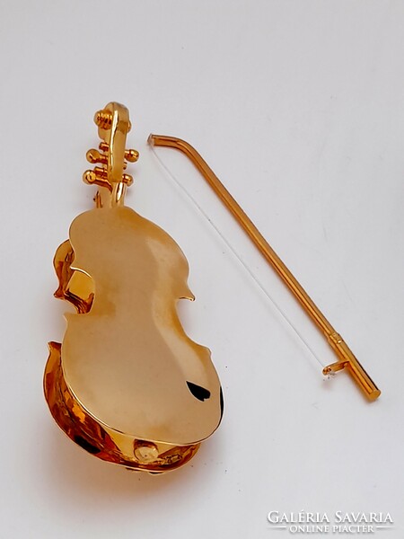 With mini copper violin case