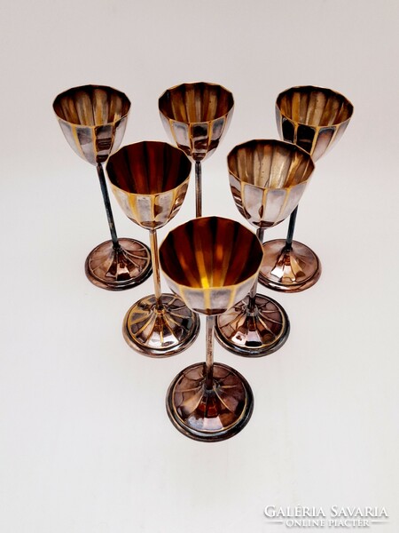 A set of short drinking glasses with a silver-plated base
