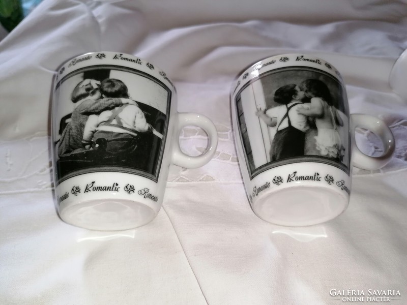 A pair of porcelain mugs with a romantic scene, the first love, which can be given as a gift