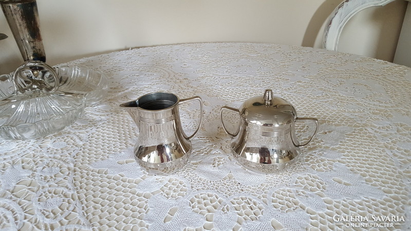 Silver-colored pewter sugar bowl with lid and milk and cream jug