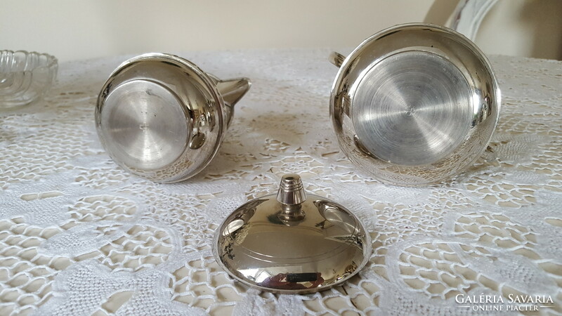 Silver-colored pewter sugar bowl with lid and milk and cream jug