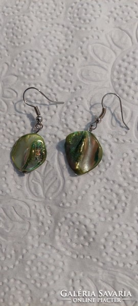 Dangle earrings made of polished shell with metal socket for sale.