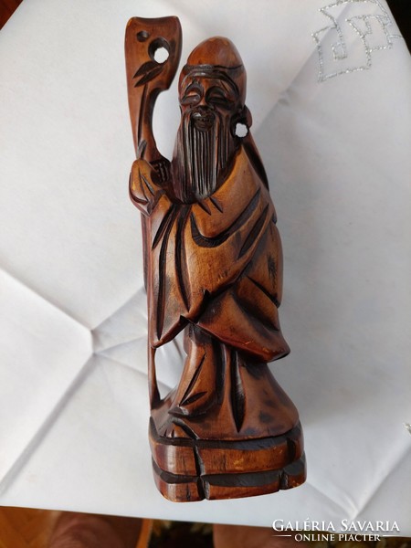 Flawless Chinese sage, meticulously carved from hard wood.