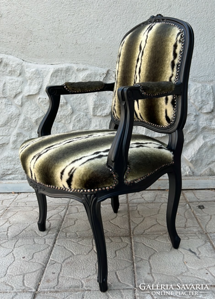 Matt black frame-style armchair with faux fur upholstery