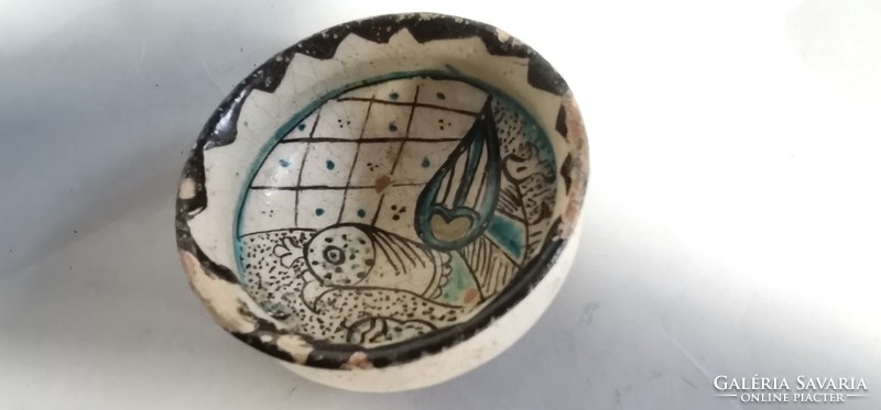 Antique bird in Middle Eastern bowl