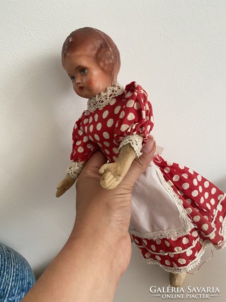 A very old machete head doll with a rag body