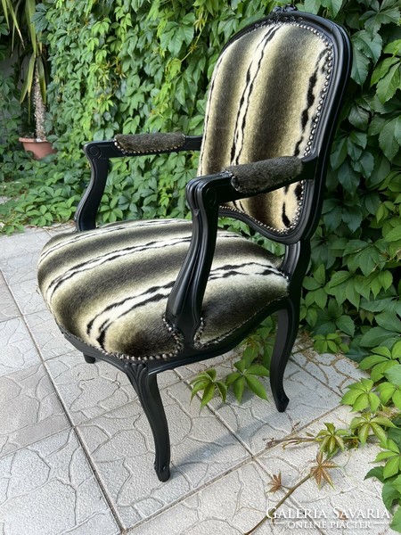 Matt black frame-style armchair with faux fur upholstery