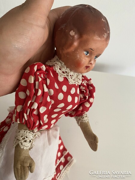 A very old machete head doll with a rag body