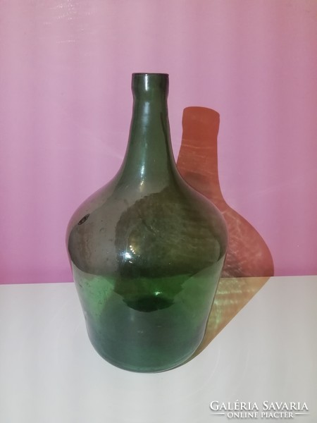 Old light green demisonne, wine bottle