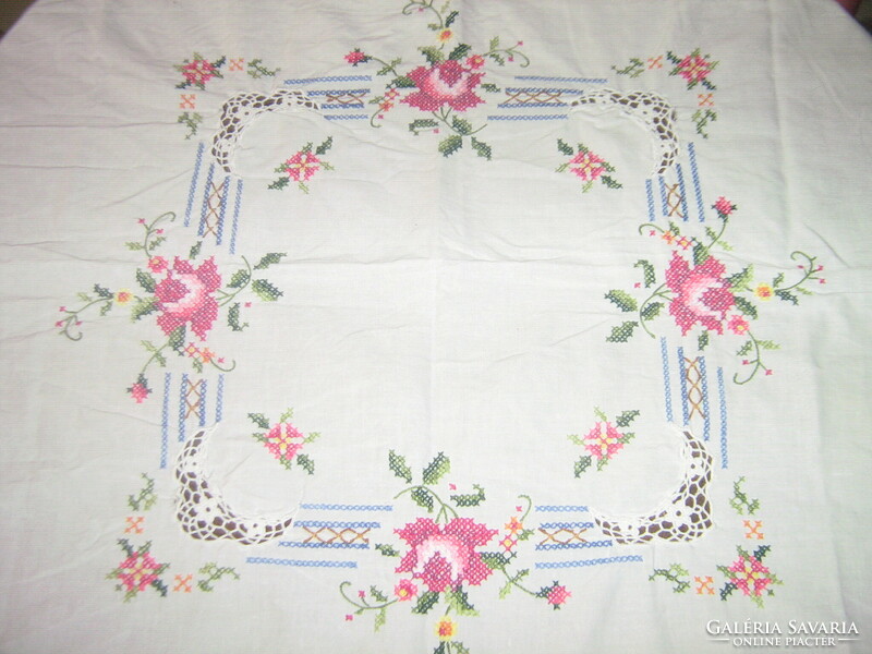Beautiful crochet rose tablecloth embroidered with tiny cross stitches